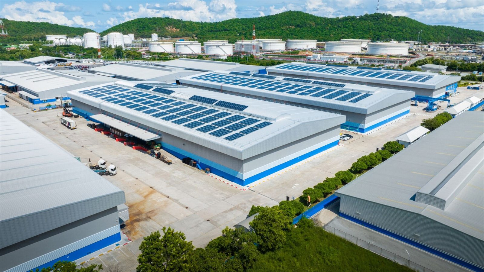 Solar panels on a large factory rooftop